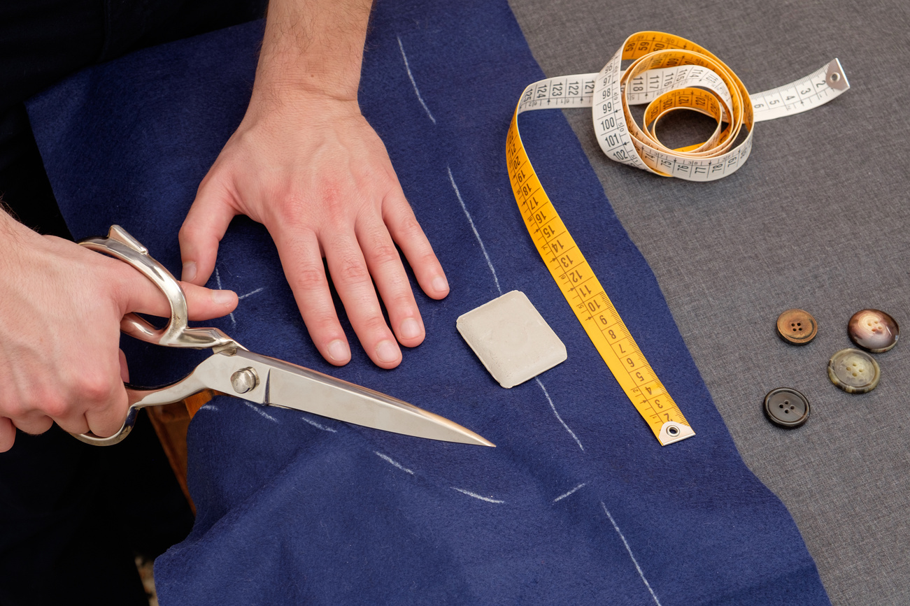 Tailor man working in his tailor shop